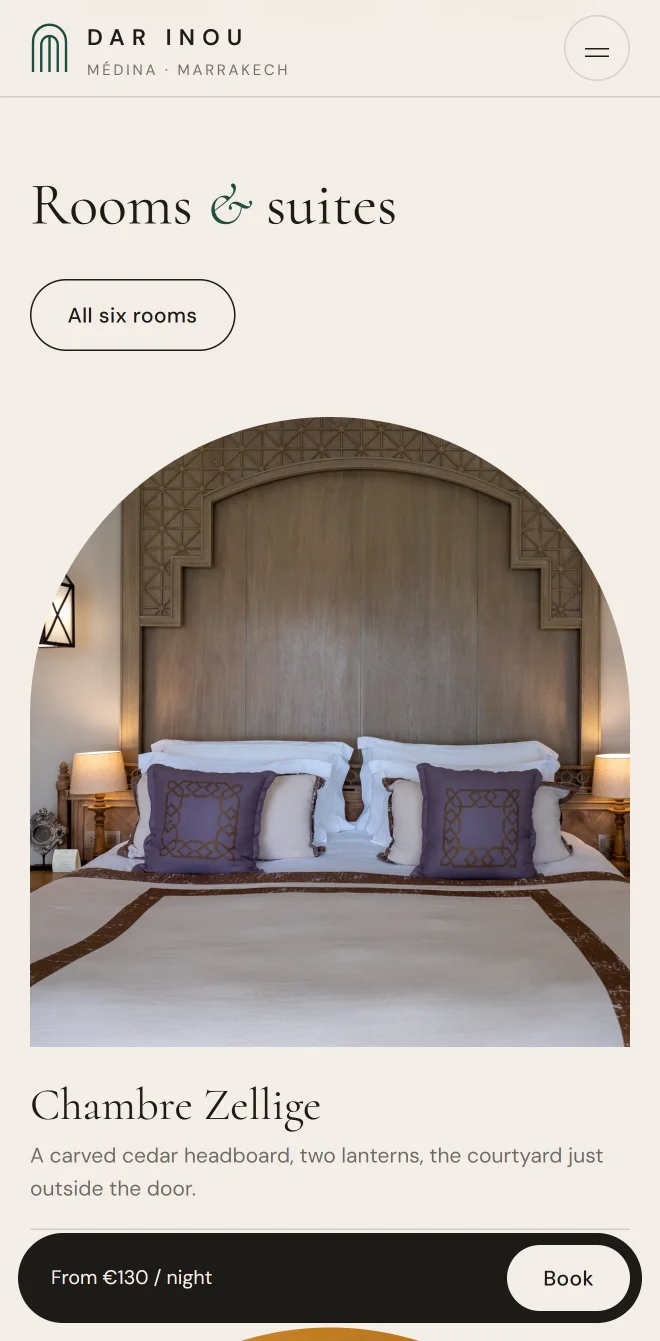 The rooms on a phone, a riad bedroom framed in an arch